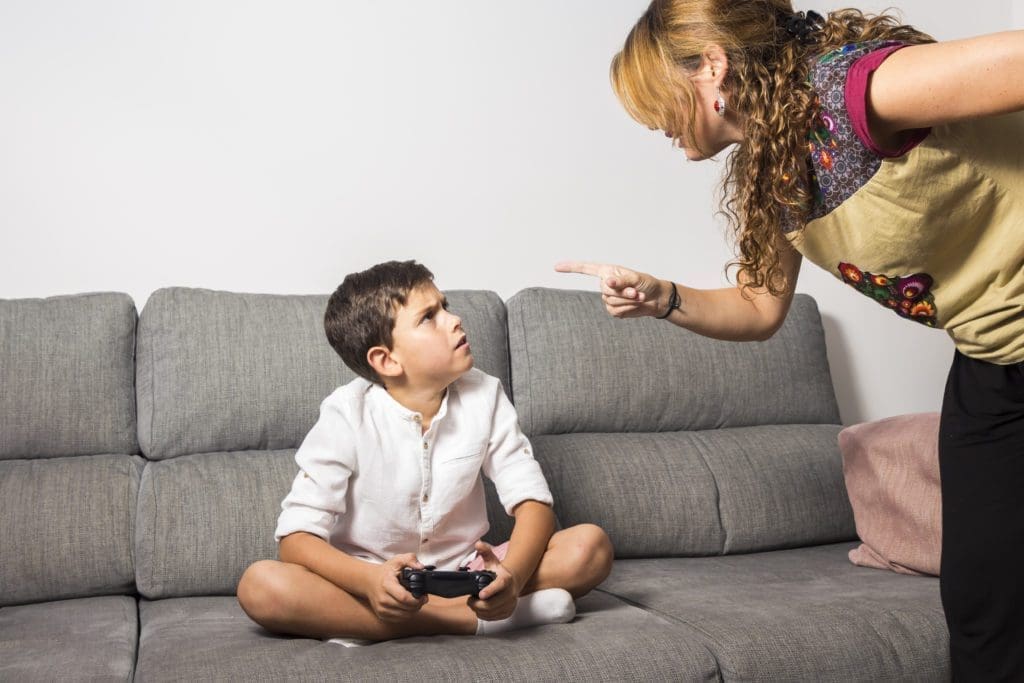 A mother disciplines her child.