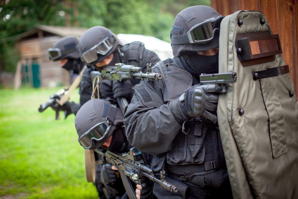 A swat team confronts a dangerous situation. Is this criminal?