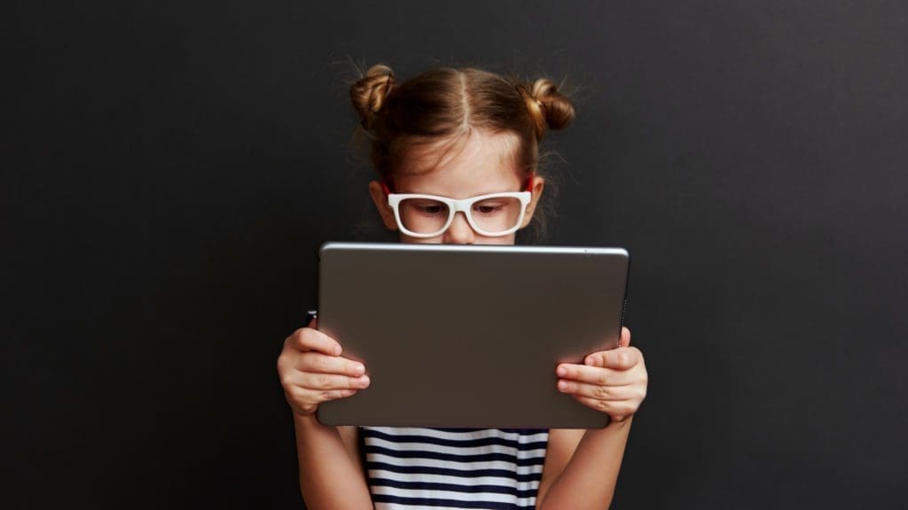 A chid uses an ipad to access the internet