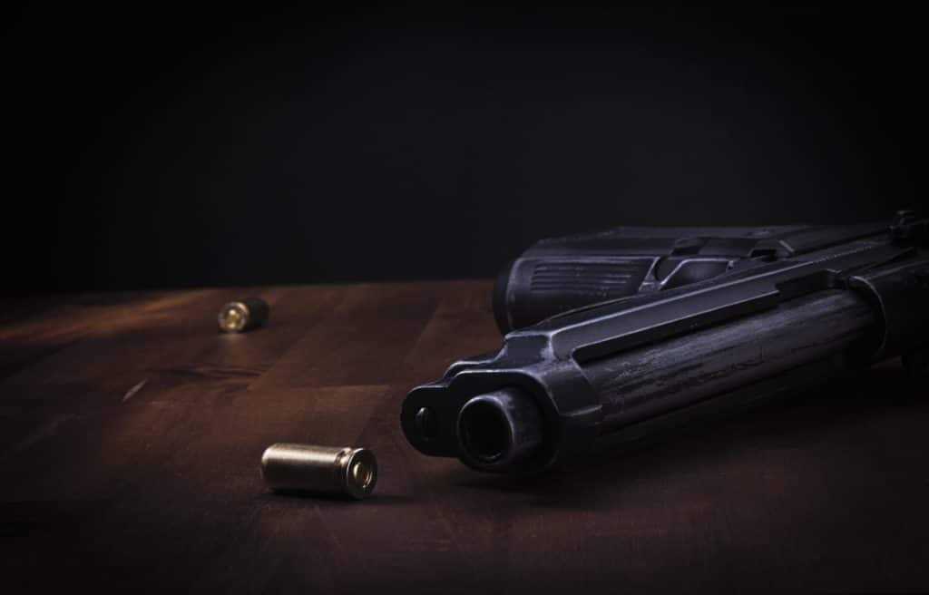 Going armed while intoxicated is illegal under Second Amendment. A firearm sits on a desk.