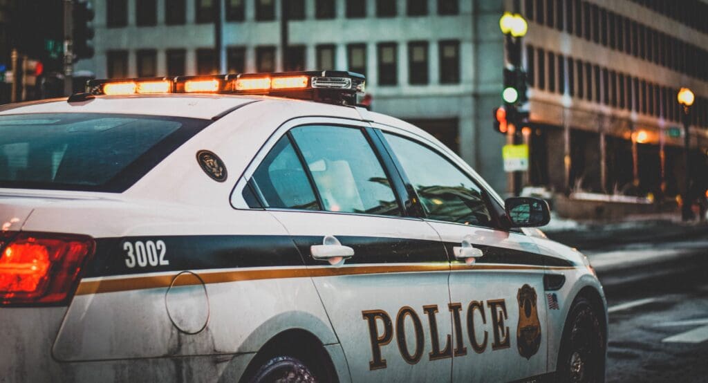 A police offering pursuing a suspect.