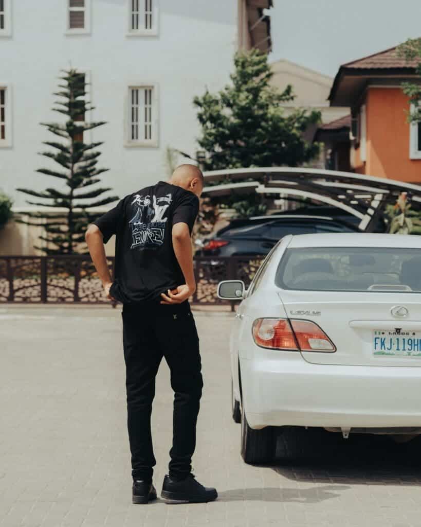 carjacking criminal defense lawyers A man looks into a stolen vehicle